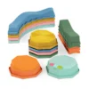 Balance & Groove Set SOFT COLORS B. toys – 8 belek równoważnych, 5 kamieni sensorycznych i moduł muzyczny, elementy ułożone w stosy